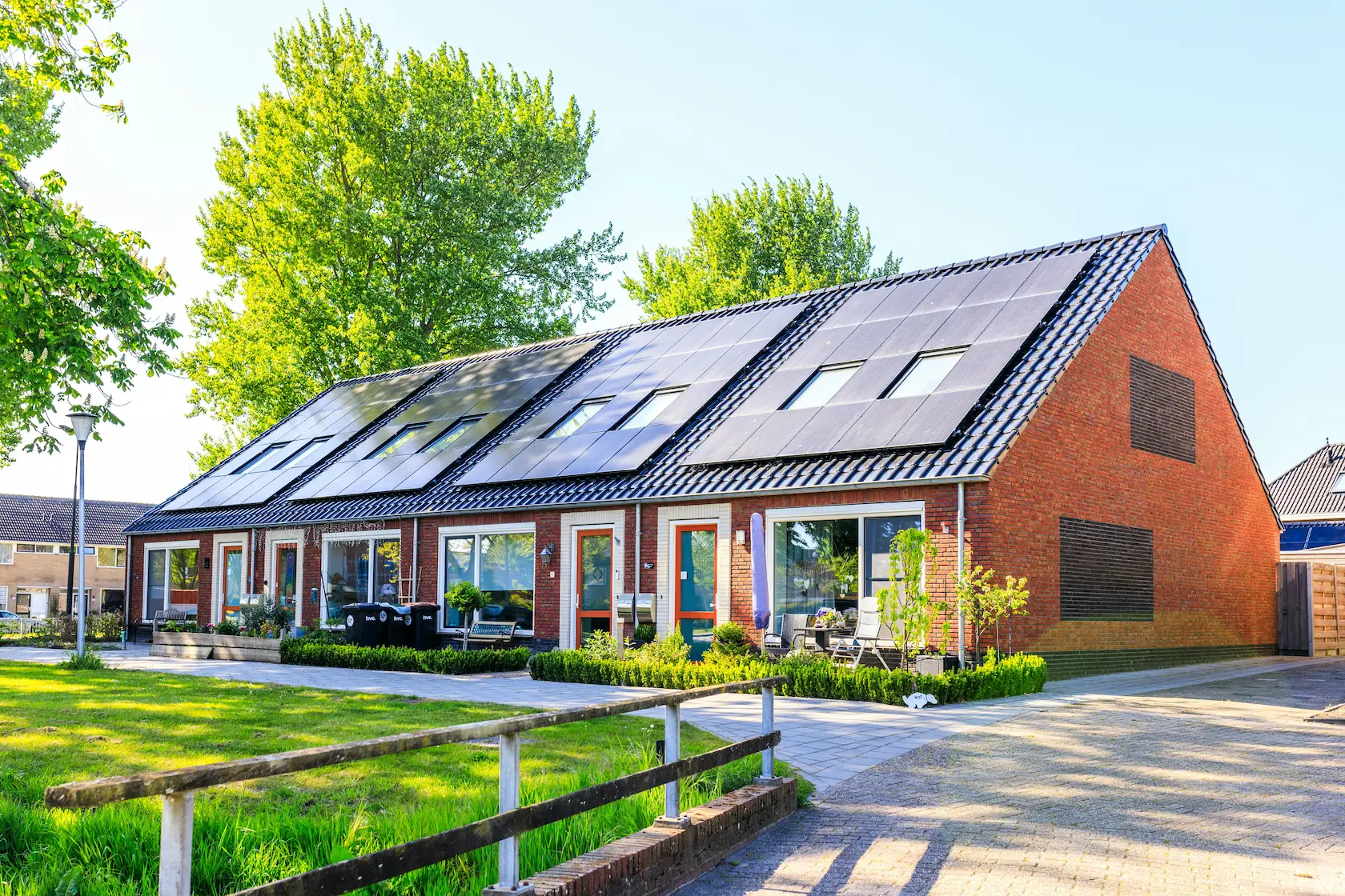 A row of homes with rooftop solar panels